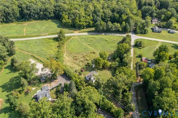 a view of a swimming pool with a yard