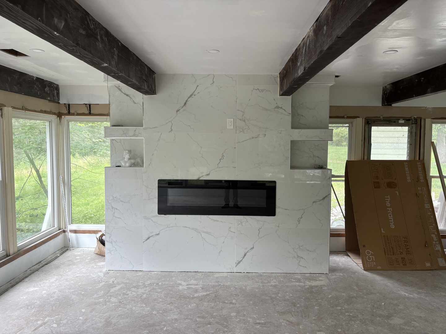 23000 Sherman Road Steger, IL 60475 - Photo 3 of 8 a living room with a fireplace and a large window