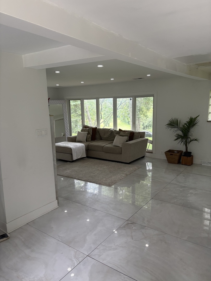 23000 Sherman Road Steger, IL 60475 - Photo 4 of 8 a living room with furniture and a large window