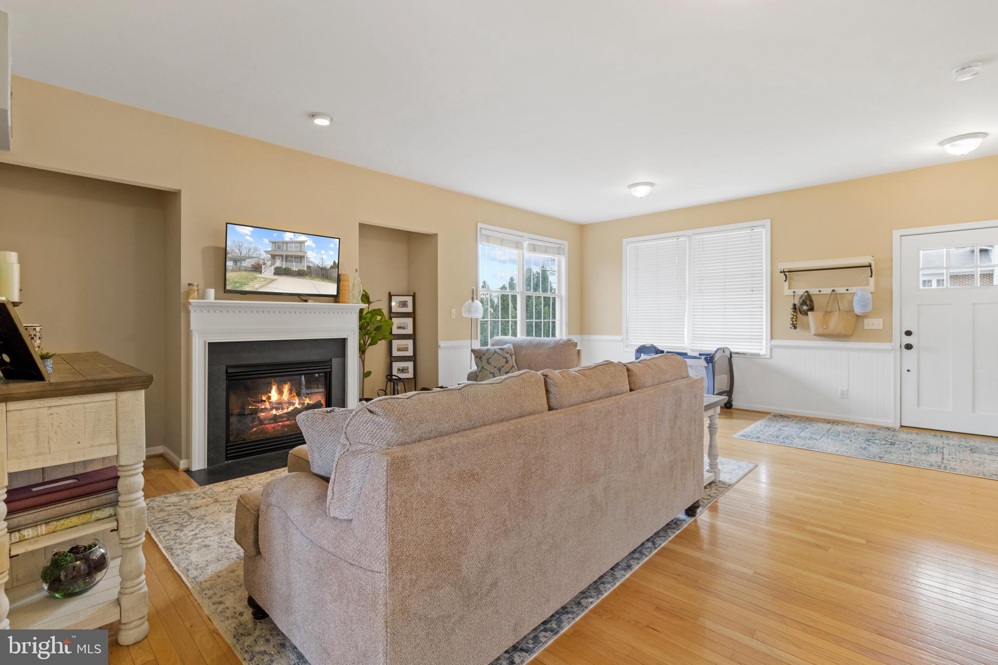 1615 Oldtown Road Edgewater, MD 21037 - Photo 6 of 35 a living room with furniture a fireplace and a flat screen tv