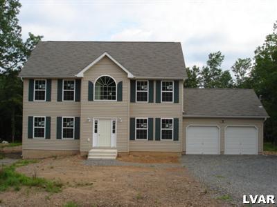 a front view of a house with a garage