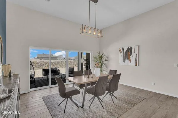 a view of a dining room with furniture window and wooden floor
