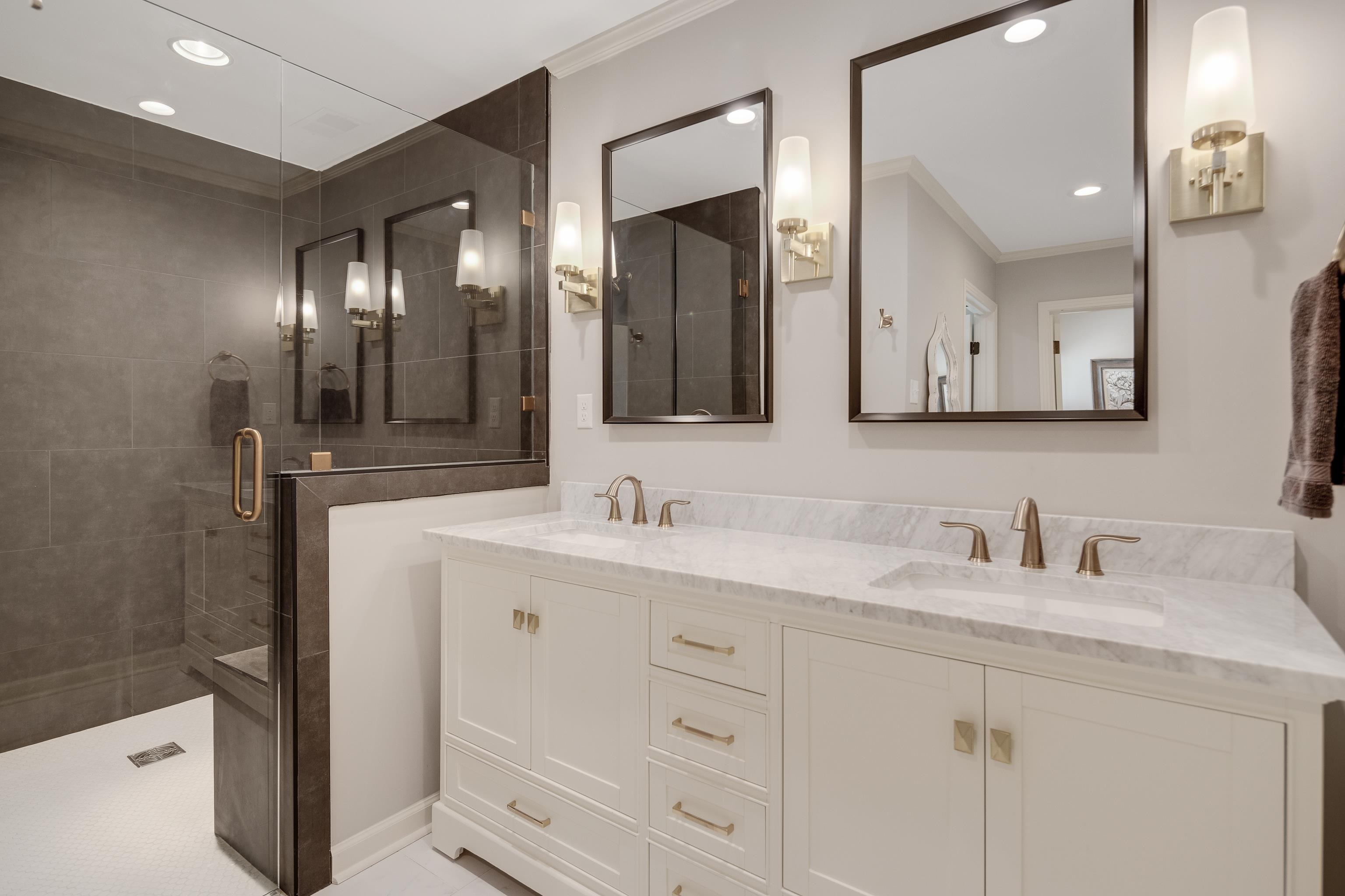 5060 Rich Road Memphis, TN 38117 - Photo 14 of 25 a bathroom with a double vanity sink and mirror