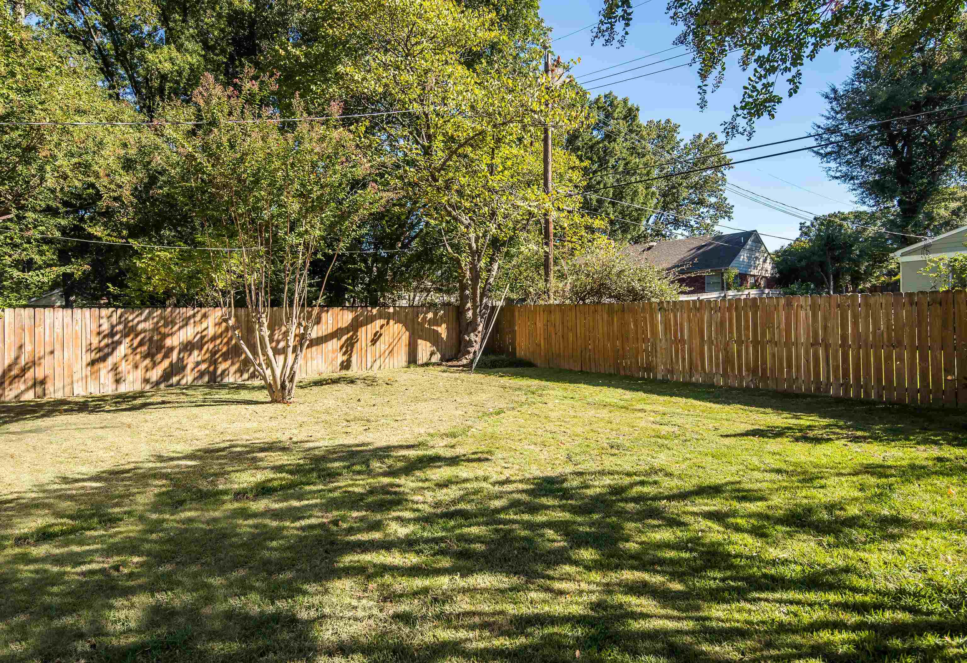 5060 Rich Road Memphis, TN 38117 - Photo 22 of 25 a view of a yard with wooden fence