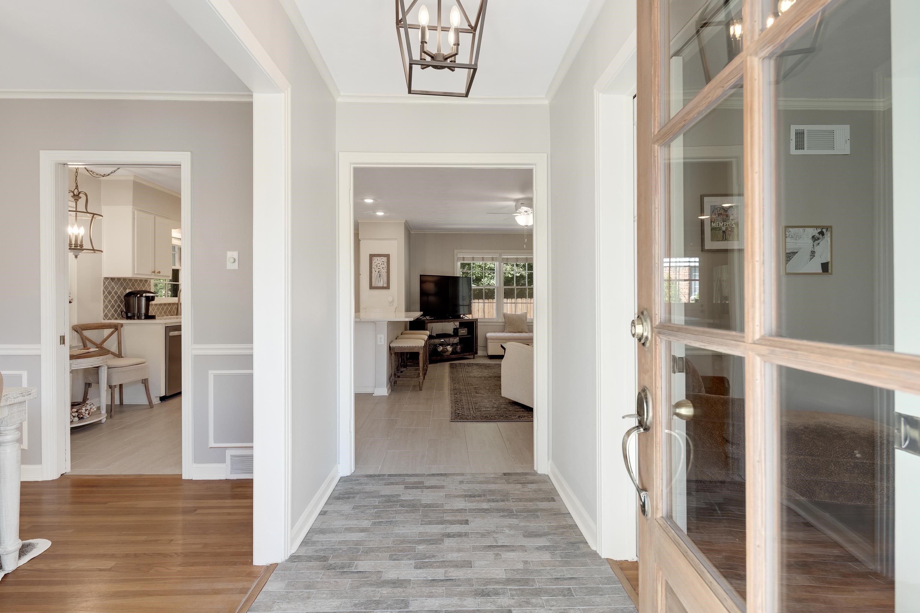 5060 Rich Road Memphis, TN 38117 - Photo 3 of 25 a view of a hallway with wooden floor and a living room