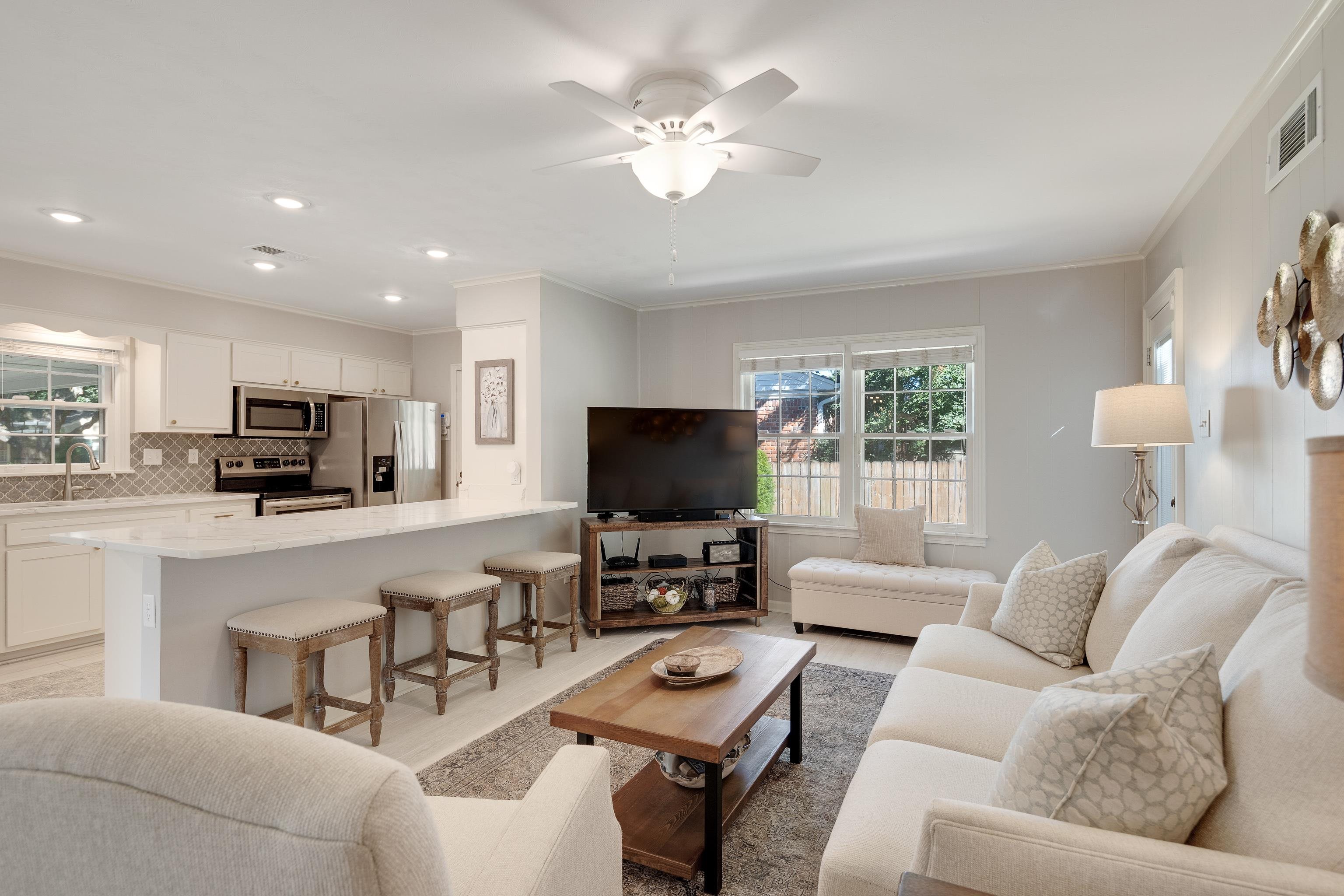 5060 Rich Road Memphis, TN 38117 - Photo 7 of 25 a living room with furniture and a flat screen tv with wooden floor