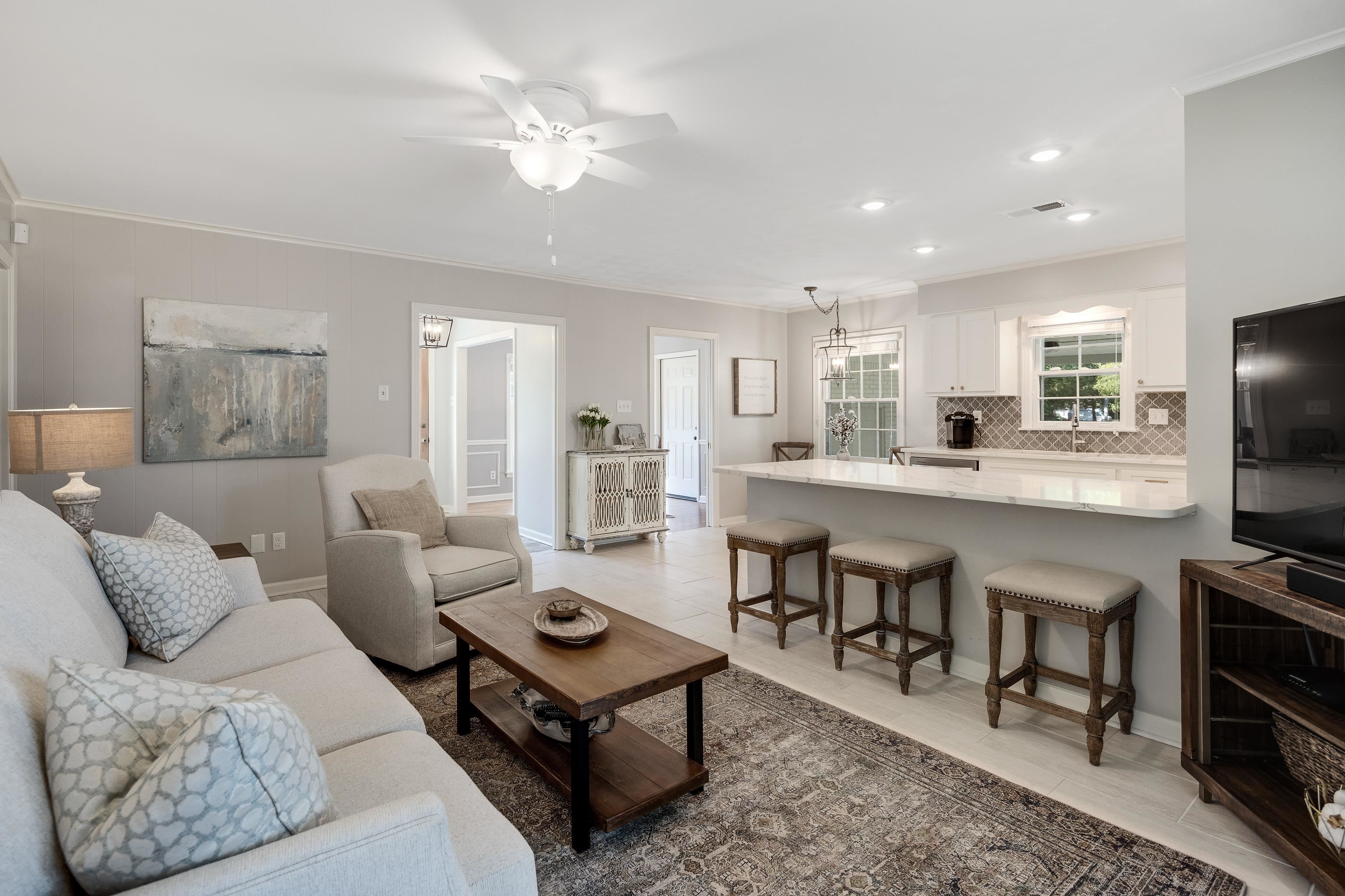 5060 Rich Road Memphis, TN 38117 - Photo 8 of 25 a living room with furniture a flat screen tv and kitchen view