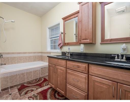 151 Groton Road Chelmsford, MA 01863 - Photo 12 of 29 a bathroom with a bathtub and a sink