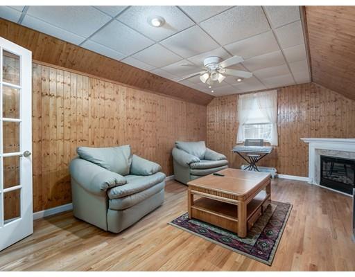 151 Groton Road Chelmsford, MA 01863 - Photo 17 of 29 a living room with furniture and a fireplace