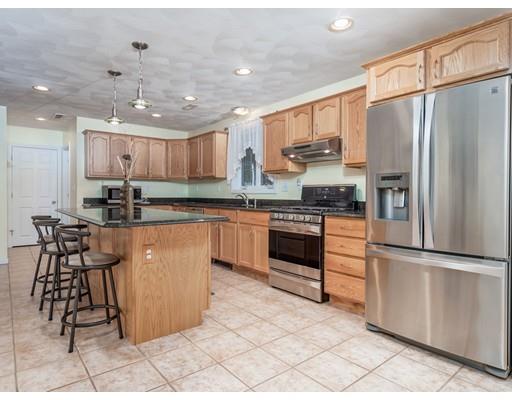 151 Groton Road Chelmsford, MA 01863 - Photo 3 of 29 a kitchen with stainless steel appliances granite countertop a stove a sink a refrigerator and a refrigerator