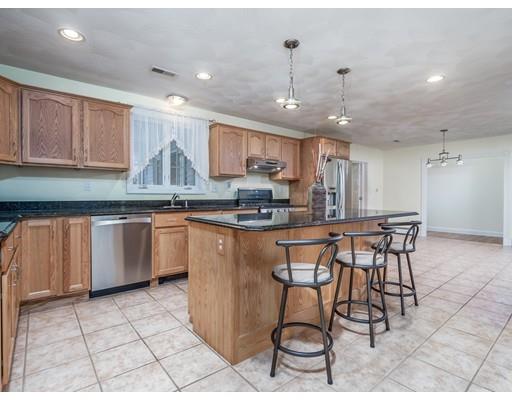 151 Groton Road Chelmsford, MA 01863 - Photo 4 of 29 a kitchen with stainless steel appliances granite countertop a stove a sink a refrigerator and a microwave