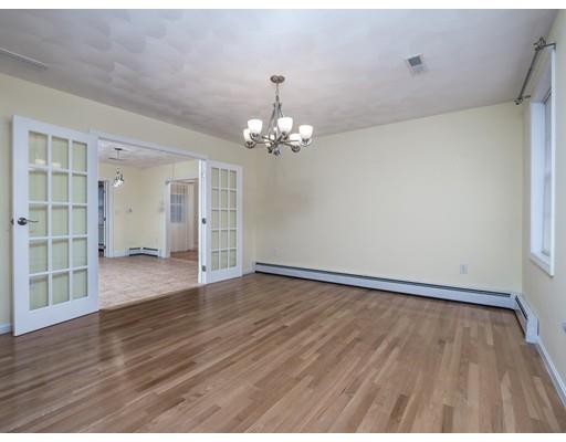 151 Groton Road Chelmsford, MA 01863 - Photo 9 of 29 a view of an empty room with wooden floor and a window