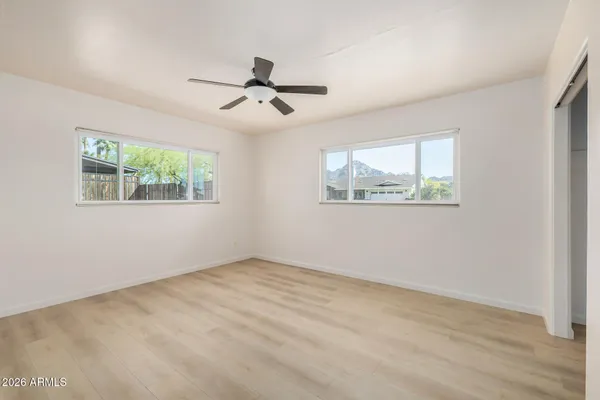 a view of a hallway with closet and entryway