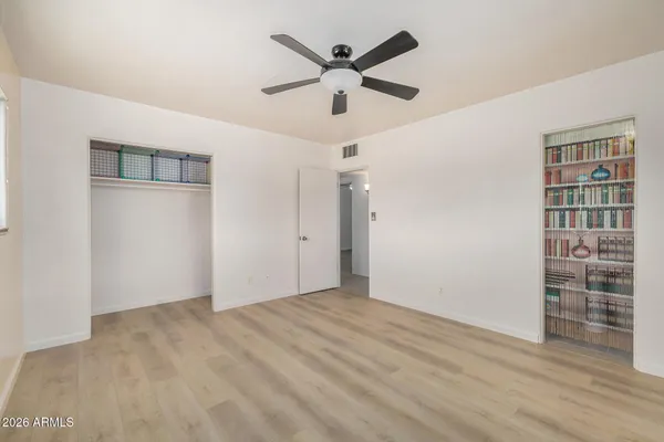 a view of an empty room with windows