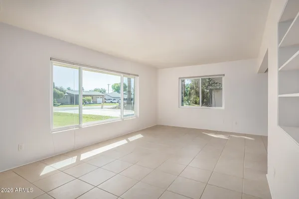 an empty room with windows