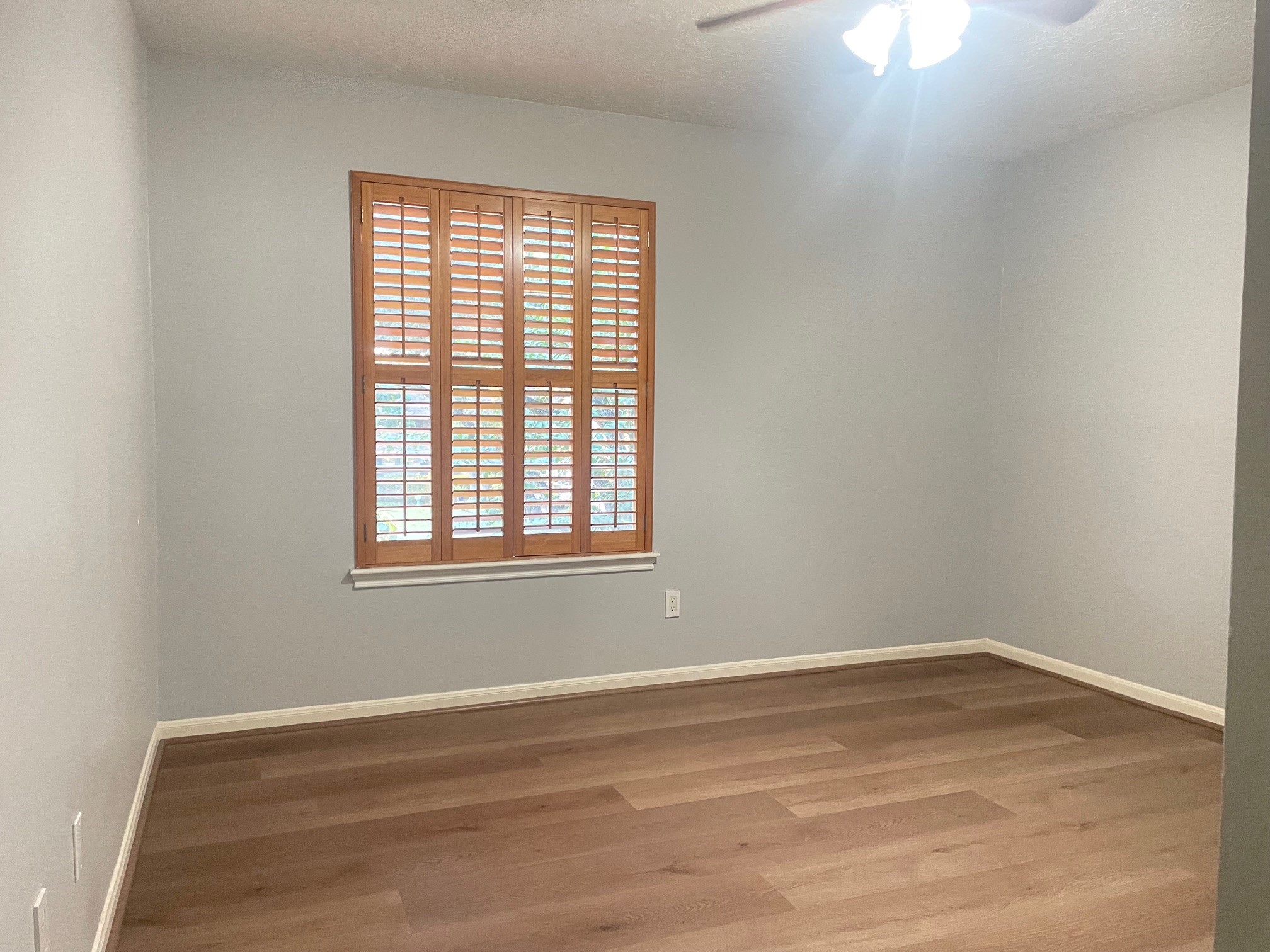 11310 Meadow Lake Drive Houston, TX 77077 - Photo 12 of 16 wooden floor in an empty room with a window