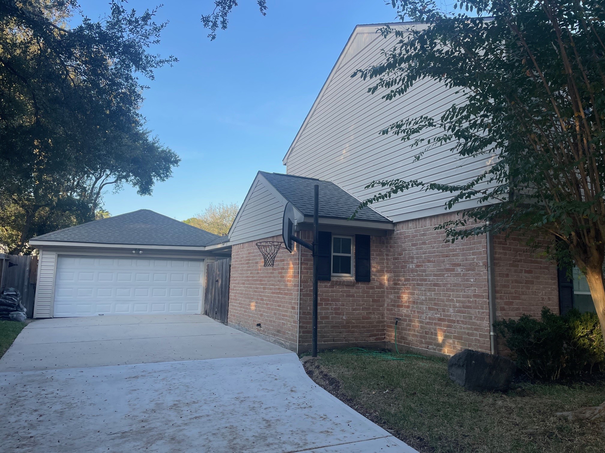 11310 Meadow Lake Drive Houston, TX 77077 - Photo 14 of 16 a front view of a house with a garden