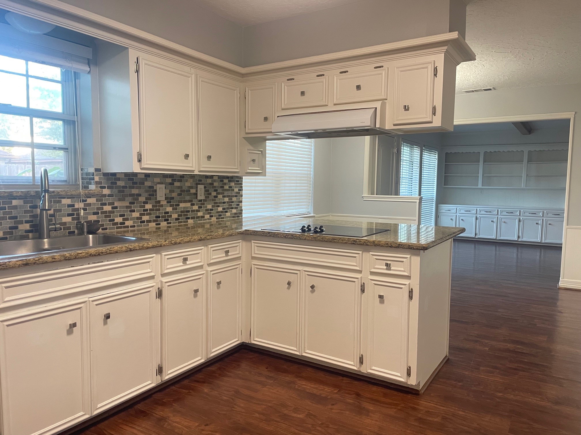 11310 Meadow Lake Drive Houston, TX 77077 - Photo 2 of 16 a kitchen with granite countertop white cabinets and white appliances
