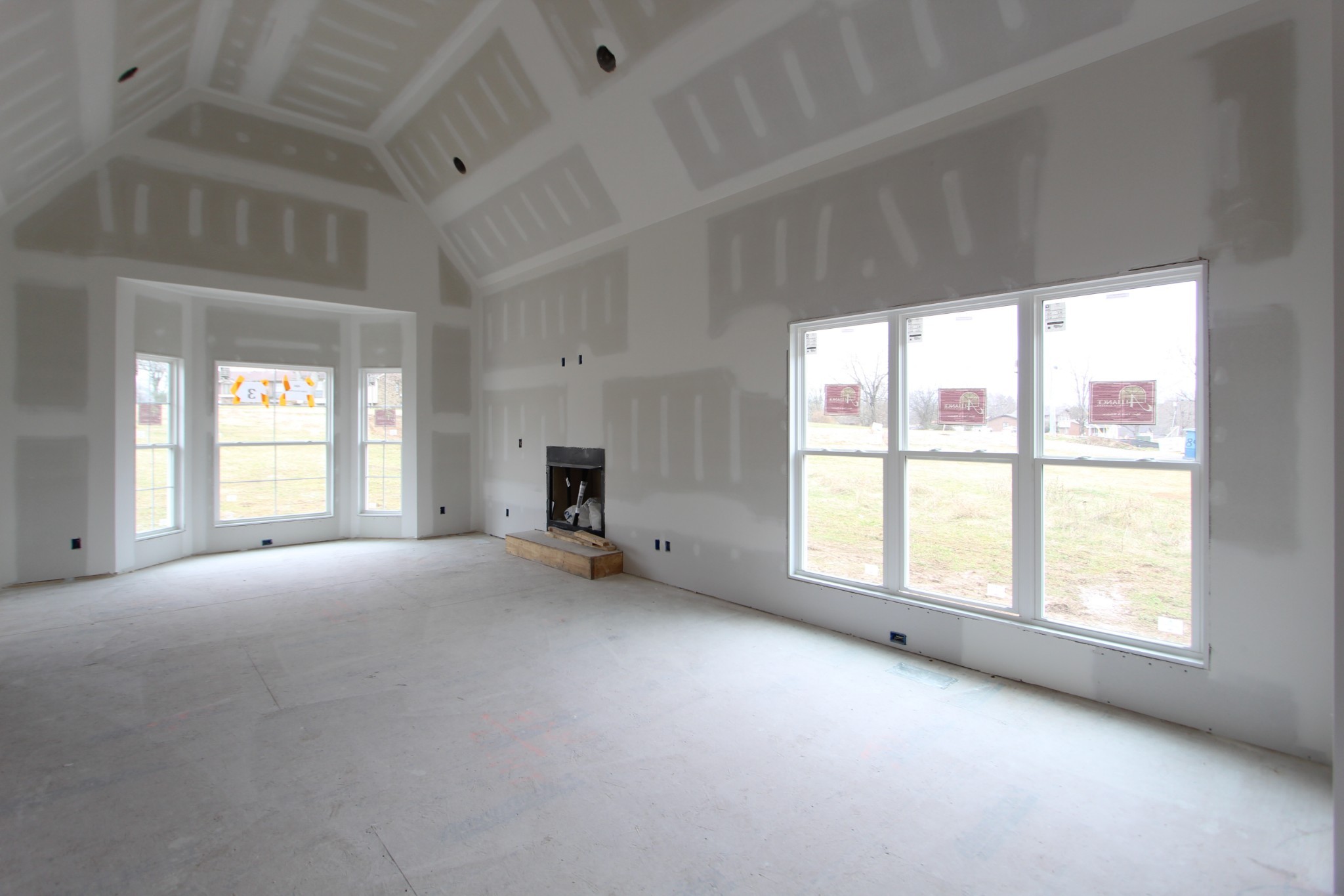 484 Cole's Ferry Road, Unit 3C Gallatin, TN 37066 - Photo 2 of 10 an empty room with windows and view of kitchen