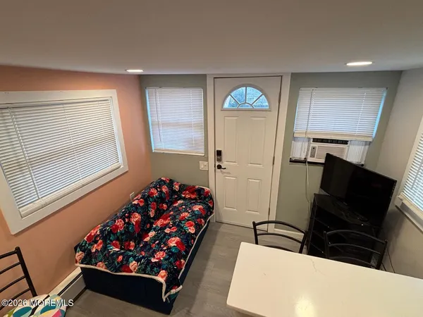 a bedroom with a bed and a chair