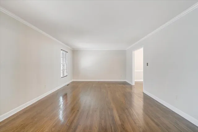 a large kitchen with granite countertop a stove a sink and a refrigerator