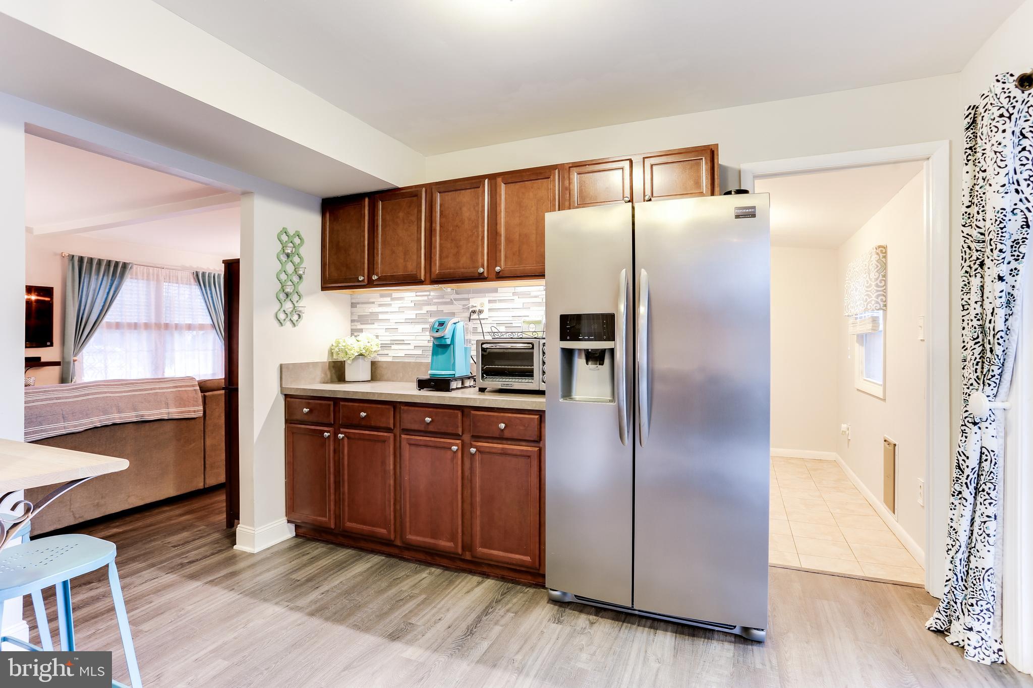 7894 Chalice Road Severn, MD 21144 - Photo 11 of 30 Bright Kitchen w/ Sliders to Rear Patio