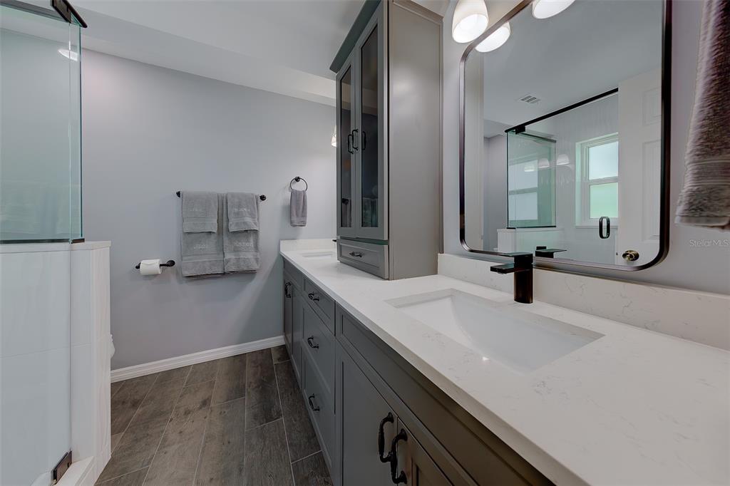 9628 122nd Way Seminole, FL 33772 - Photo 16 of 53 a bathroom with a sink and mirror
