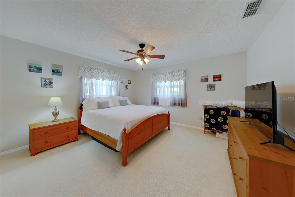 9628 122nd Way Seminole, FL 33772 - Photo 19 of 53 a bedroom with bed and window