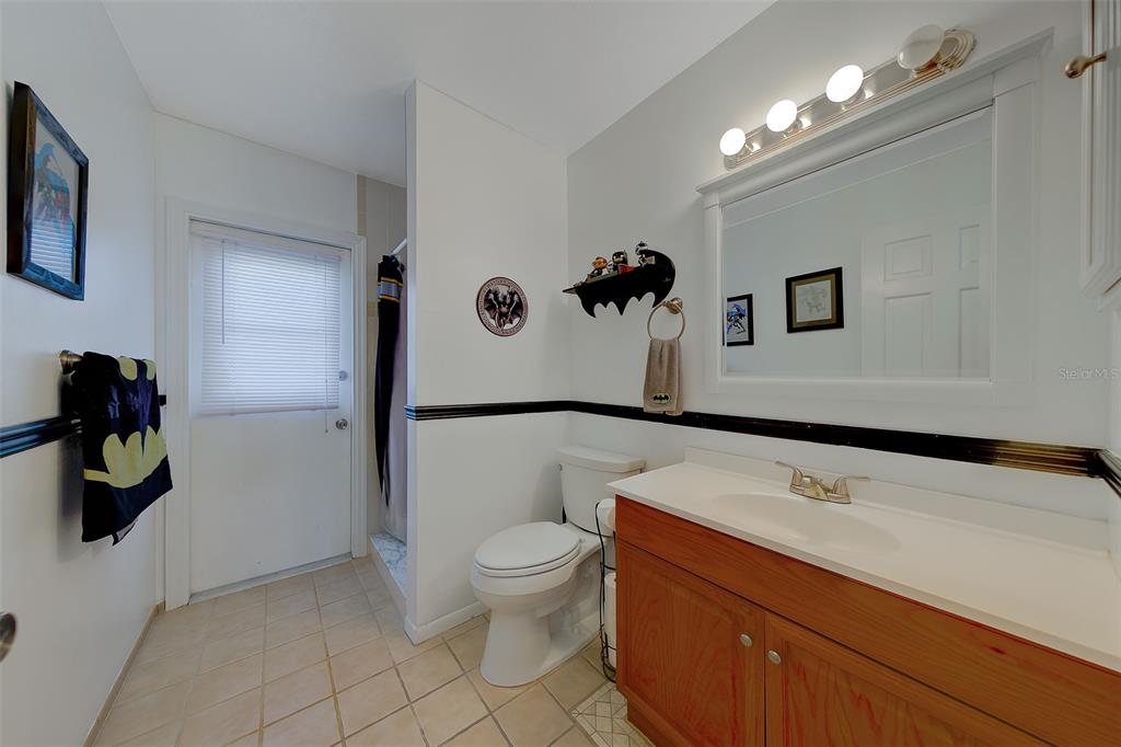 9628 122nd Way Seminole, FL 33772 - Photo 23 of 53 a bathroom with a sink a toilet and a shower