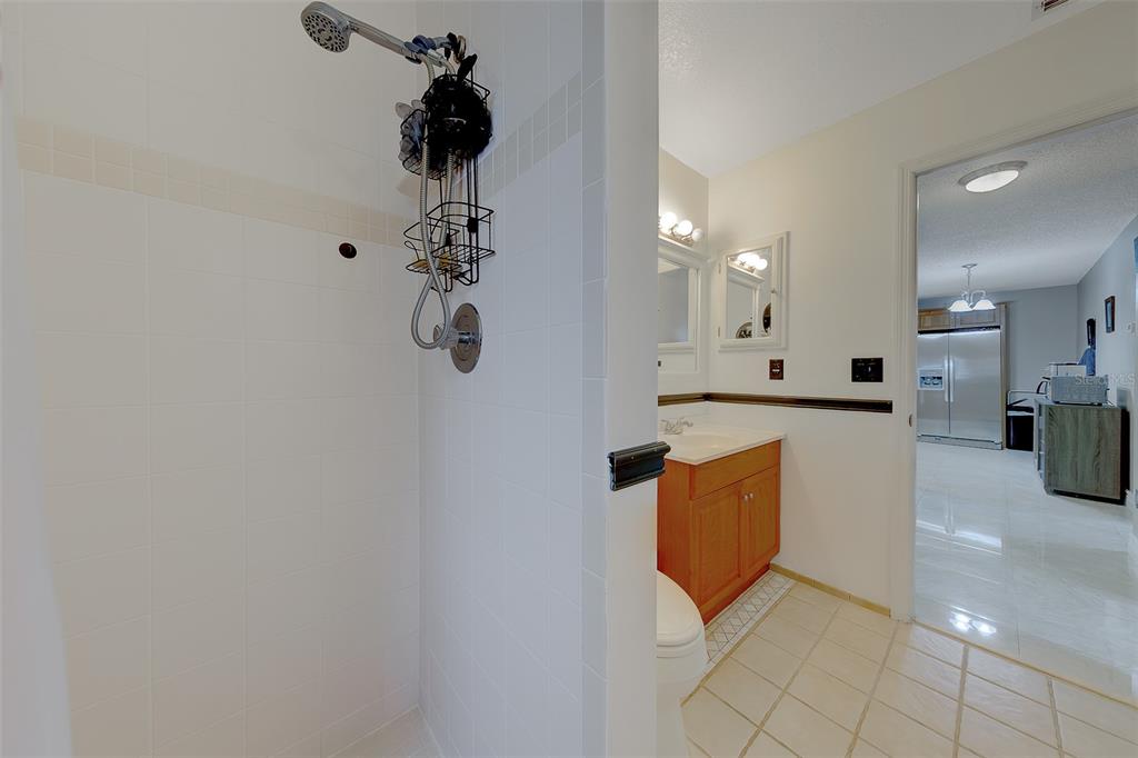 9628 122nd Way Seminole, FL 33772 - Photo 24 of 53 a kitchen with stainless steel appliances granite countertop a sink a stove top oven and cabinets