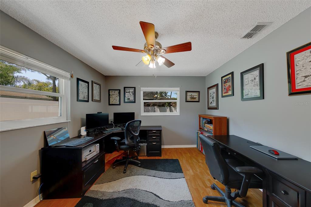 9628 122nd Way Seminole, FL 33772 - Photo 25 of 53 a view of a workspace with furniture and a window