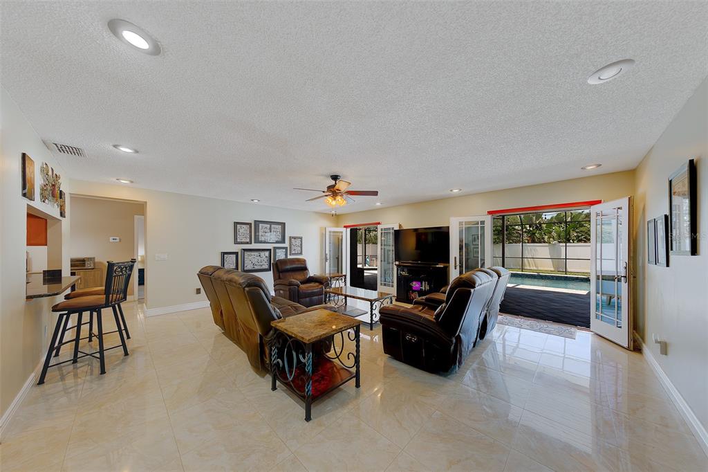 9628 122nd Way Seminole, FL 33772 - Photo 27 of 53 a living room with furniture and a large window