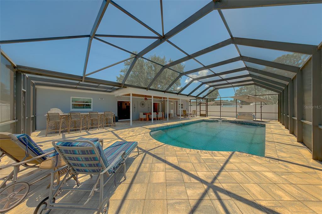 9628 122nd Way Seminole, FL 33772 - Photo 31 of 53 a view of a swimming pool with a patio