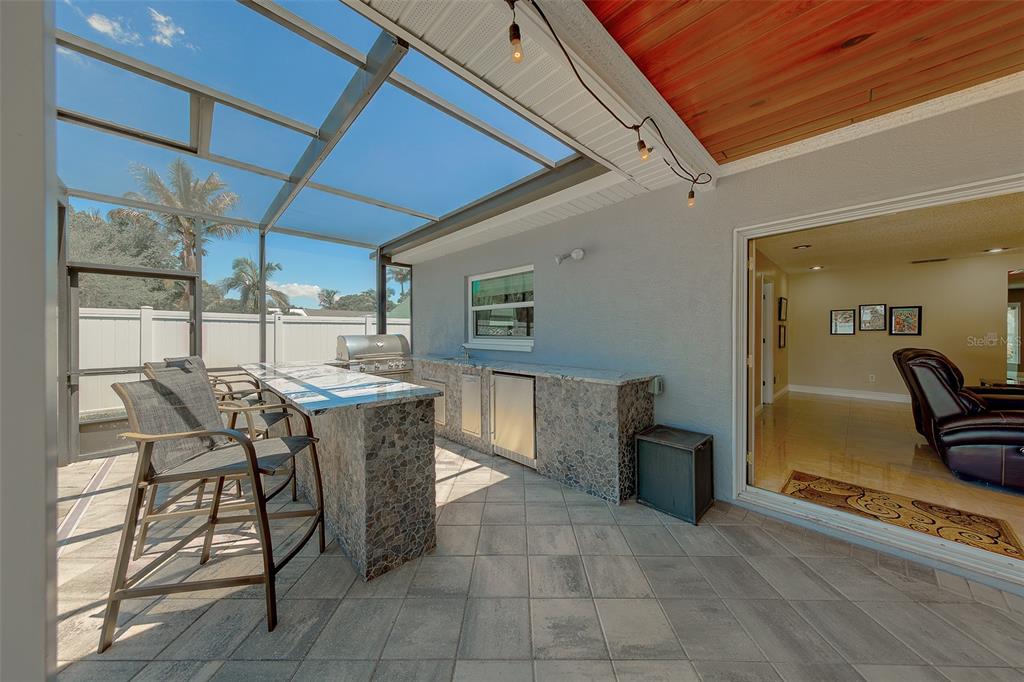 9628 122nd Way Seminole, FL 33772 - Photo 33 of 53 a kitchen with a table and chairs