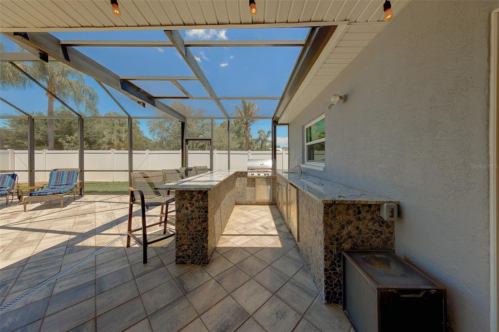 9628 122nd Way Seminole, FL 33772 - Photo 34 of 53 a view of a porch with furniture and a yard
