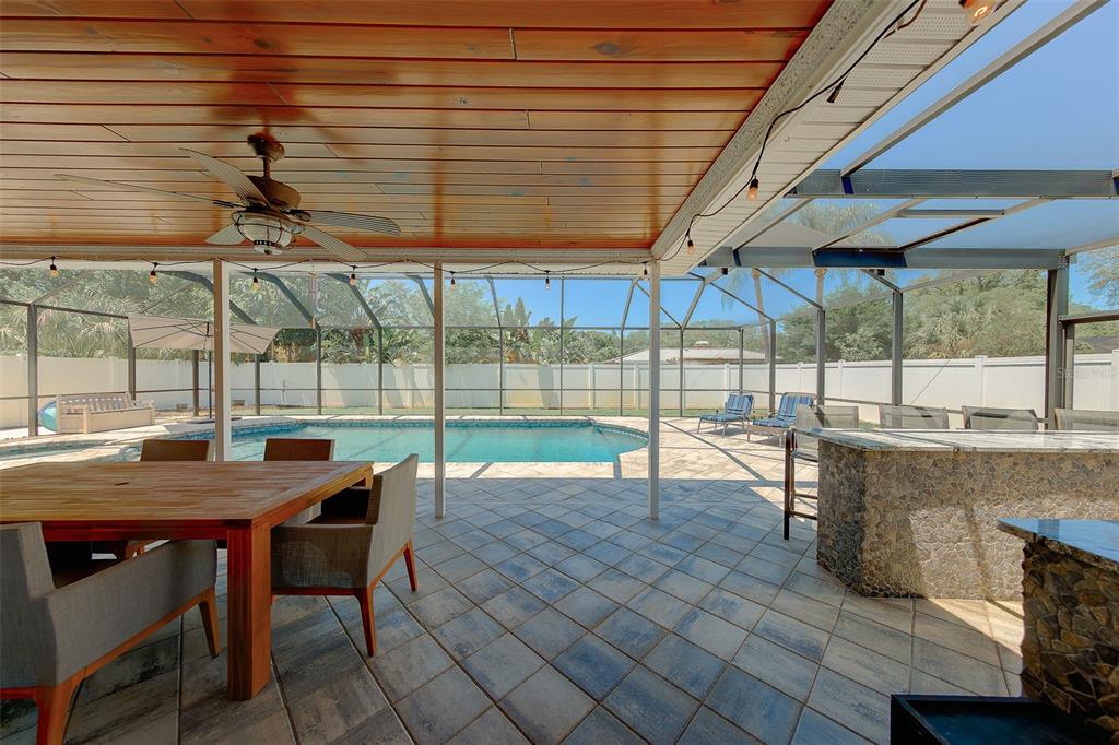 9628 122nd Way Seminole, FL 33772 - Photo 35 of 53 a view of a patio with a table and chairs