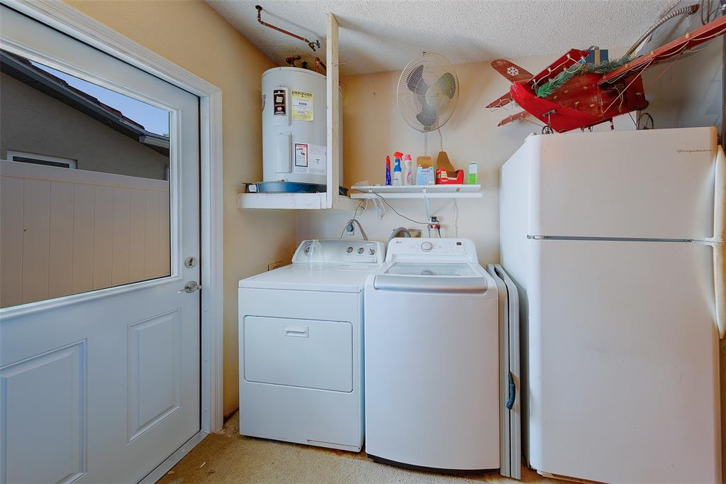 9628 122nd Way Seminole, FL 33772 - Photo 39 of 53 a utility room with dryer and washer