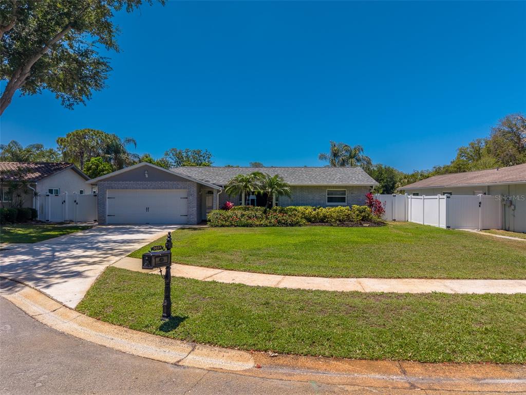 9628 122nd Way Seminole, FL 33772 - Photo 40 of 53 a front view of a house with a yard