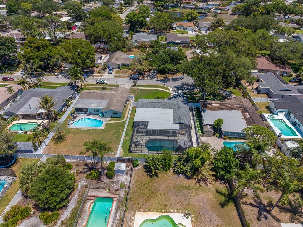 9628 122nd Way Seminole, FL 33772 - Photo 45 of 53 an aerial view of a house with a swimming pool yard and outdoor seating