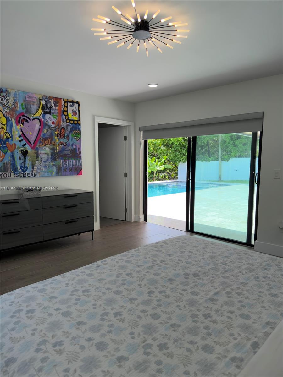 2350 Northeast 194th Street Miami, FL 33180 - Photo 13 of 24 a view of a room with window and ceiling fan