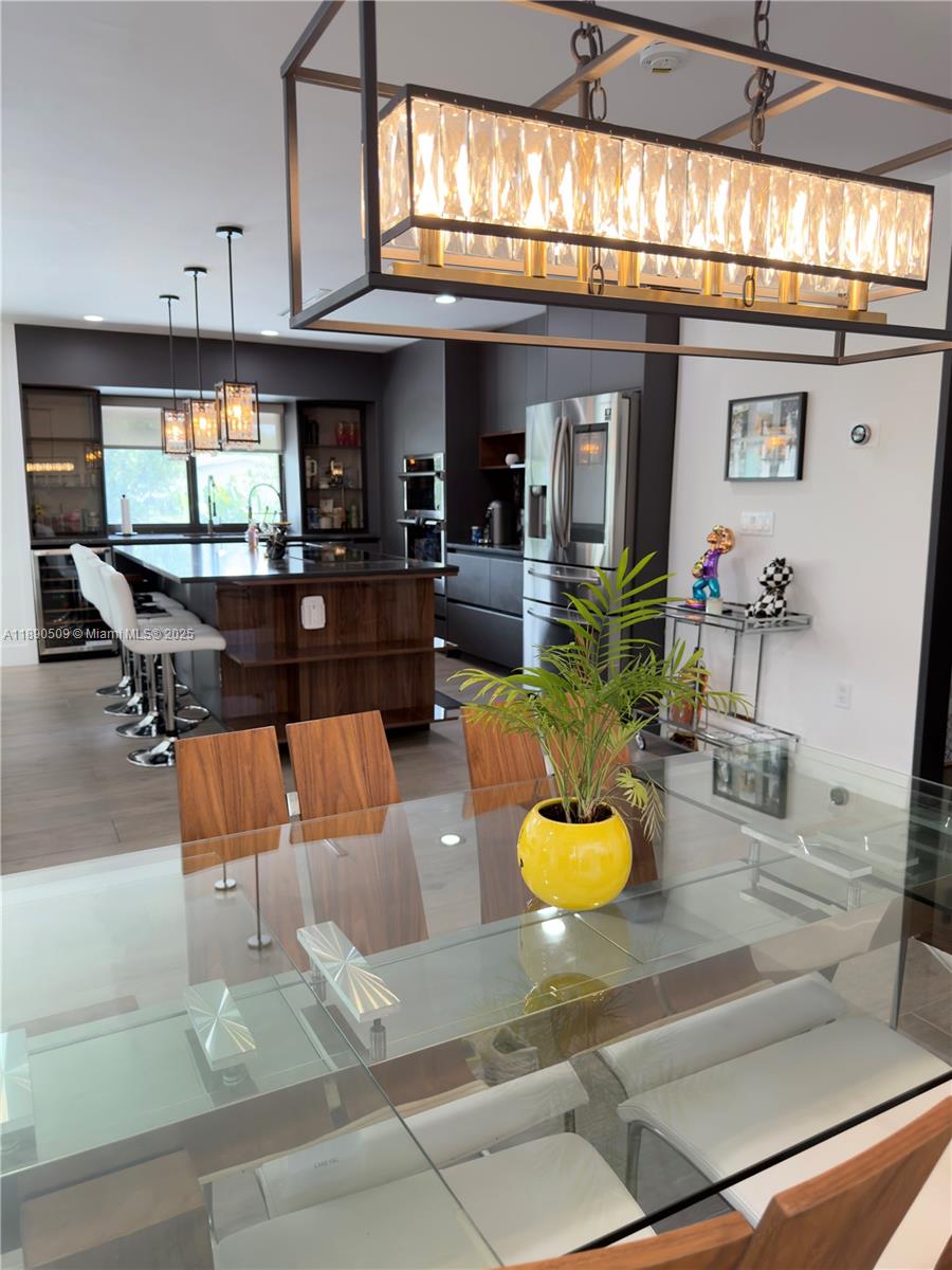 2350 Northeast 194th Street Miami, FL 33180 - Photo 9 of 24 a living room with fireplace furniture and a large window