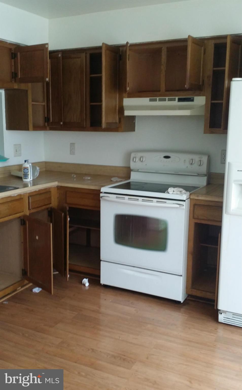 8659 Ritchboro Road District Heights, MD 20747 - Photo 2 of 13 a kitchen with a stove and a sink