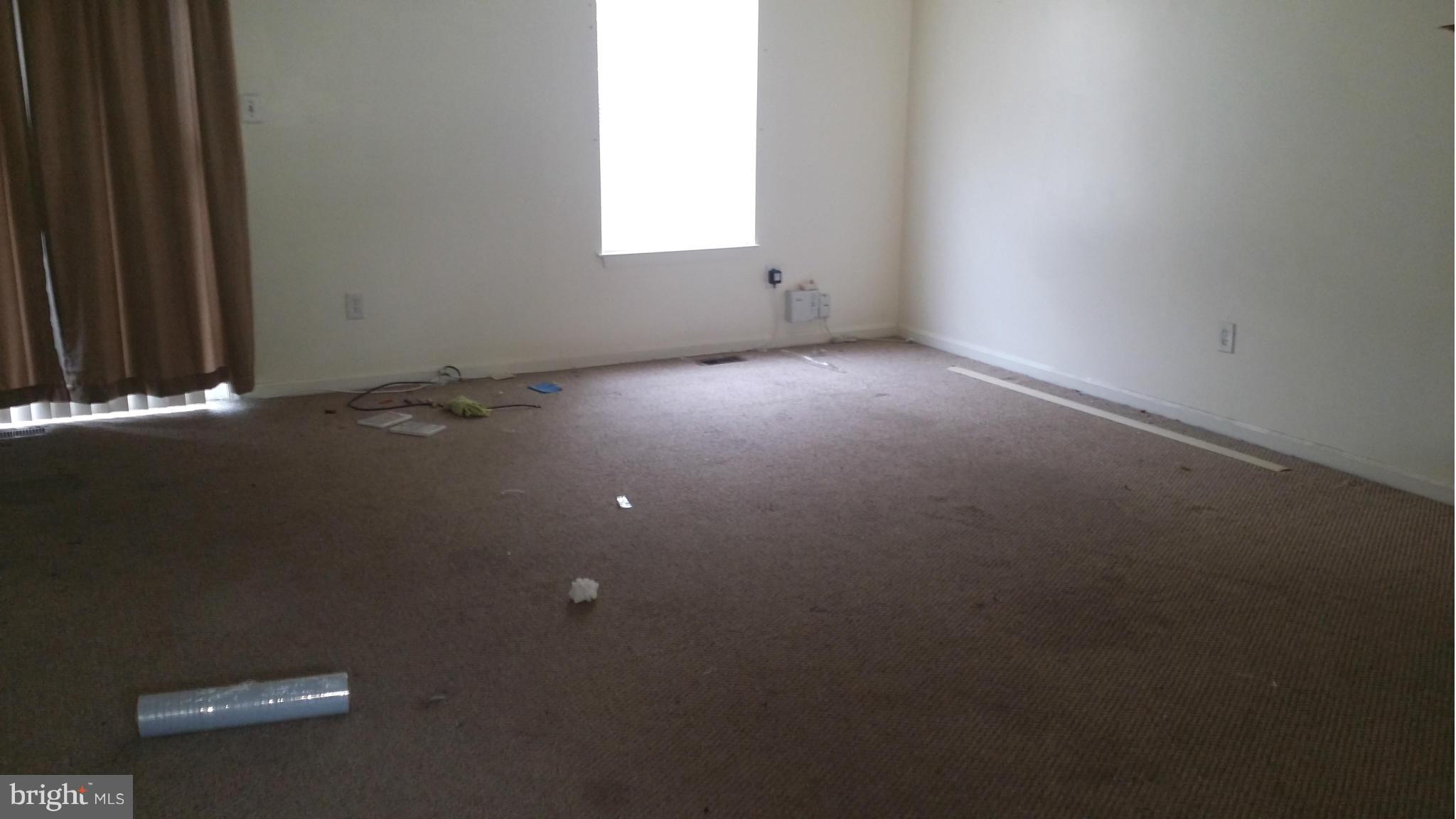 8659 Ritchboro Road District Heights, MD 20747 - Photo 3 of 13 an empty room with a window