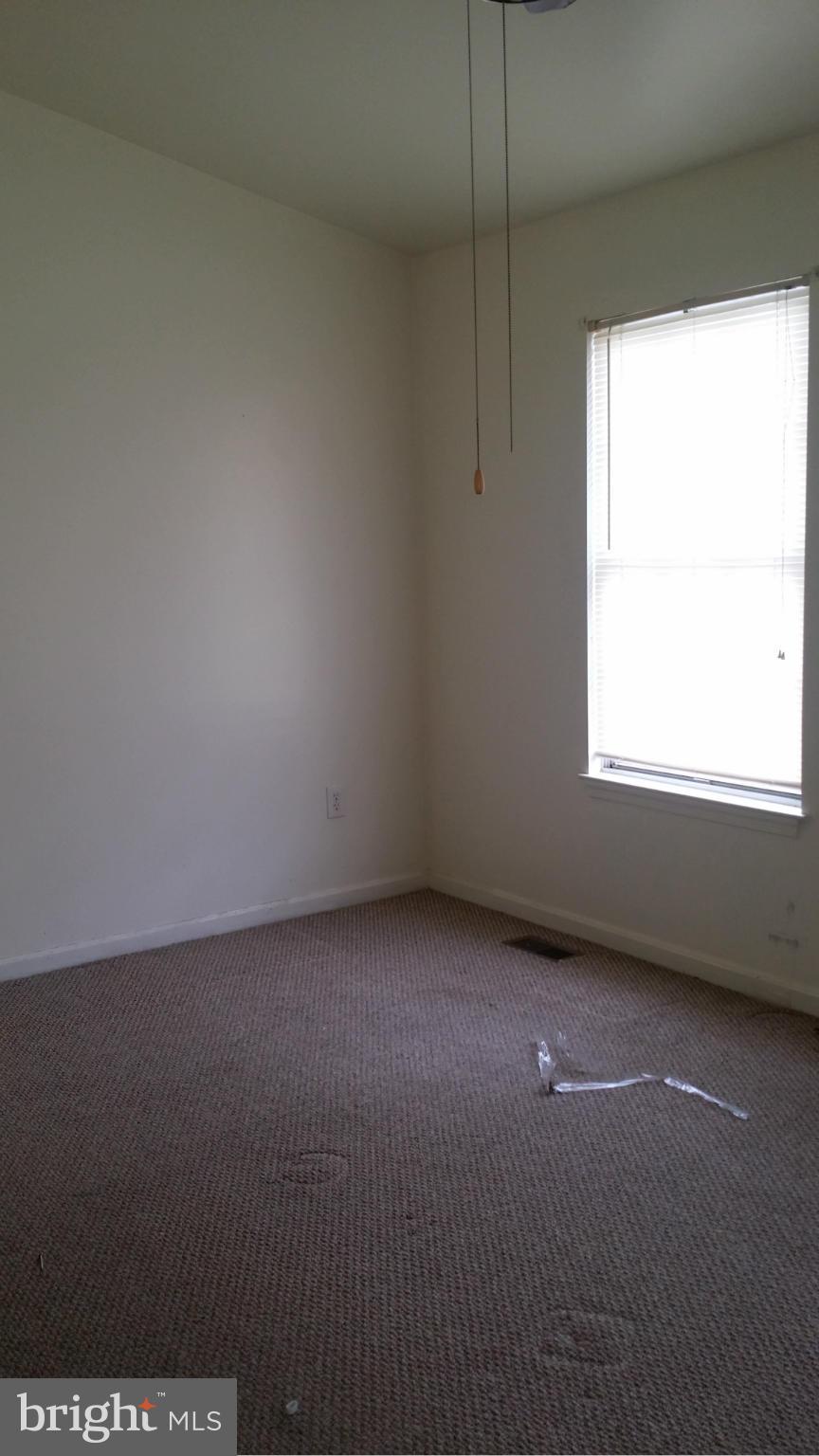 8659 Ritchboro Road District Heights, MD 20747 - Photo 7 of 13 a view of a room that has a window in it