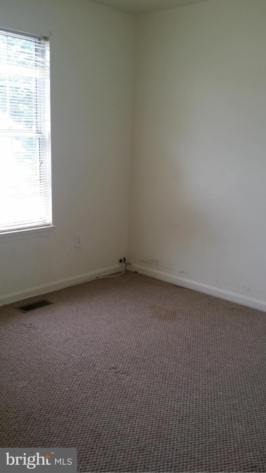 8659 Ritchboro Road District Heights, MD 20747 - Photo 8 of 13 an empty room with a window