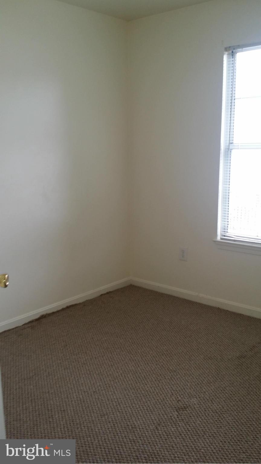 8659 Ritchboro Road District Heights, MD 20747 - Photo 9 of 13 a view of an empty room and window