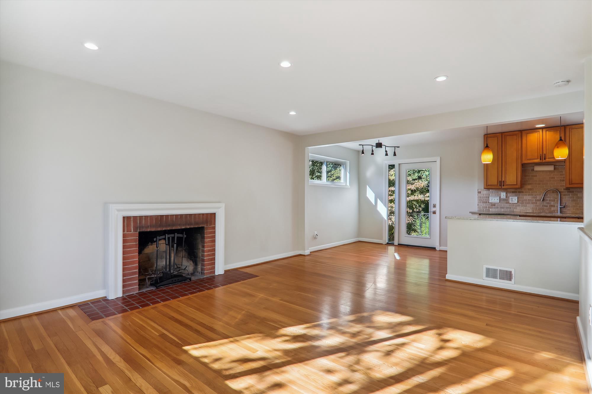 10708 Lombardy Road Silver Spring, MD 20901 - Photo 13 of 95 Living Room to Dining area & rear door