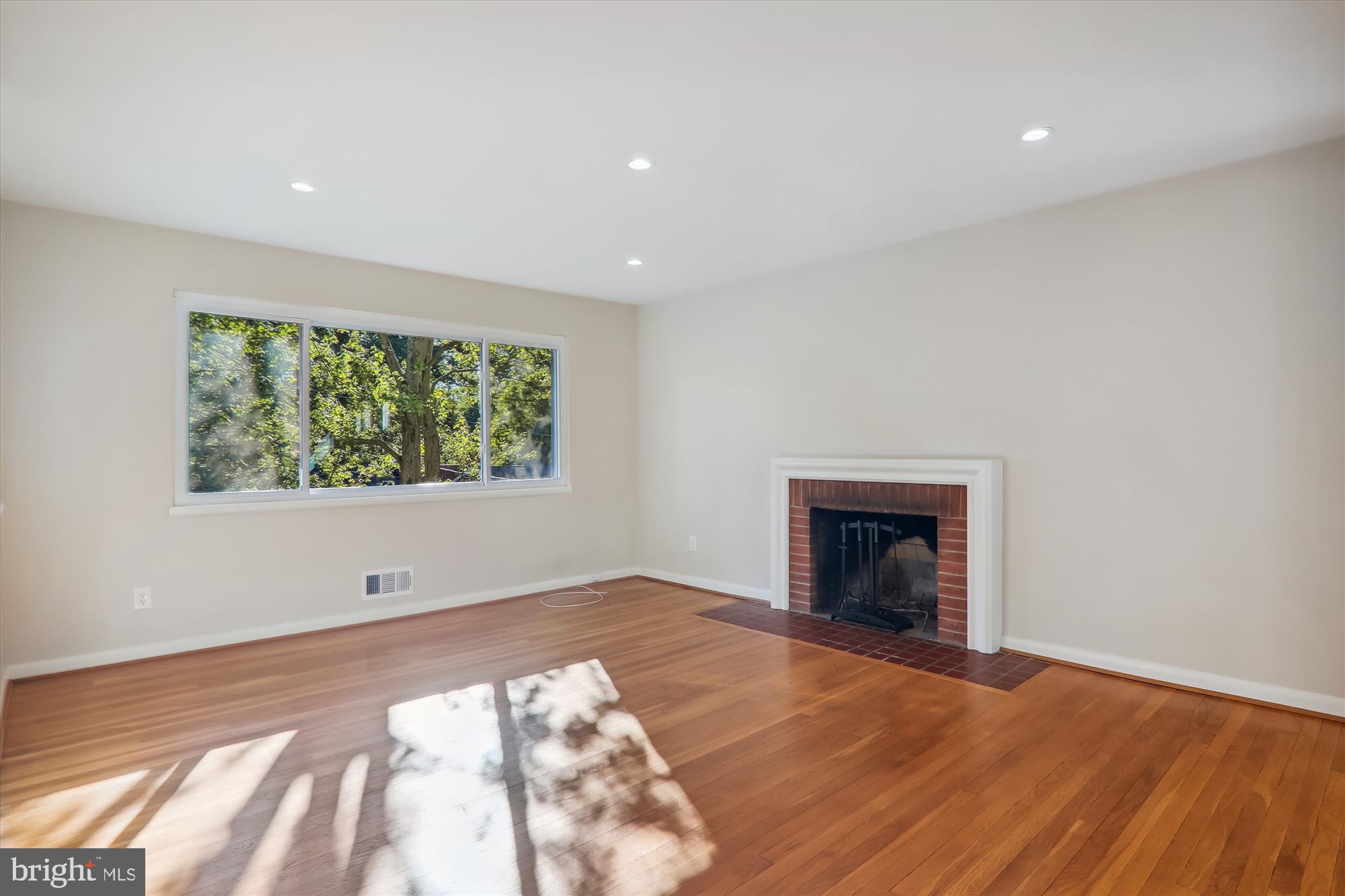 10708 Lombardy Road Silver Spring, MD 20901 - Photo 15 of 95 Living room fireplace & picture window