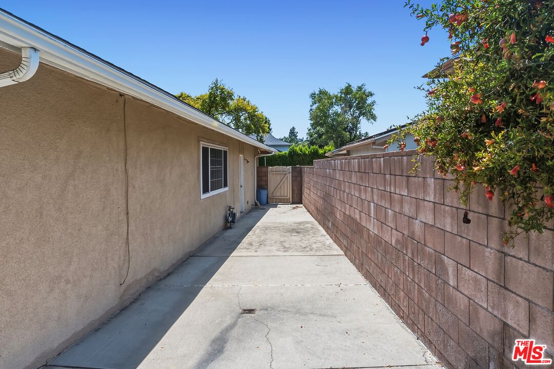 19131 Tulsa Street Porter Ranch, CA 91326 - Photo 35 of 43 a view of a pathway of a house with wooden fence