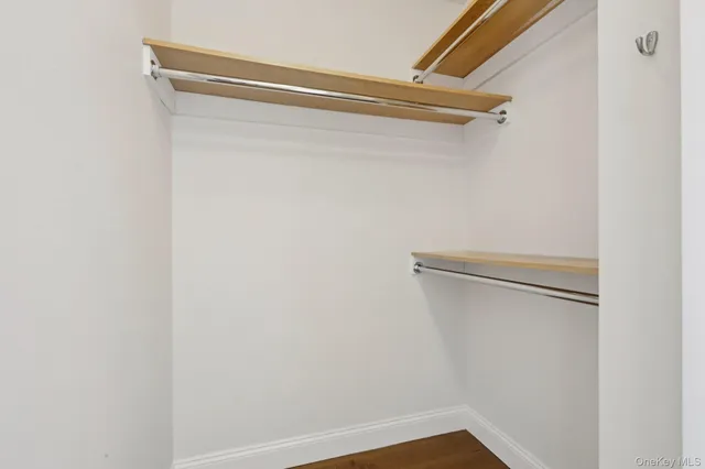 a spacious bathroom with a bathtub shower sink and mirror